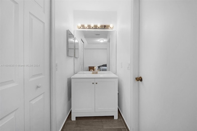 bathroom featuring hardwood / wood-style floors and vanity