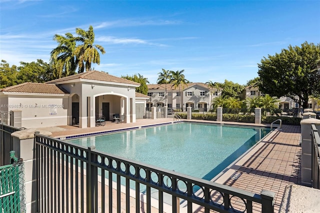 view of swimming pool featuring a patio area