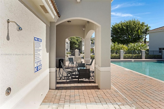 view of swimming pool featuring a patio area