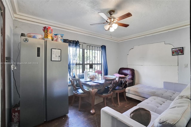 dining room with a textured ceiling, dark hardwood / wood-style flooring, ceiling fan, and ornamental molding