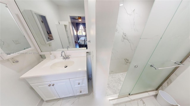 bathroom featuring a shower and vanity