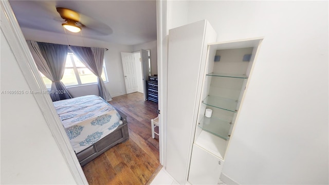 bedroom featuring dark hardwood / wood-style floors and ceiling fan