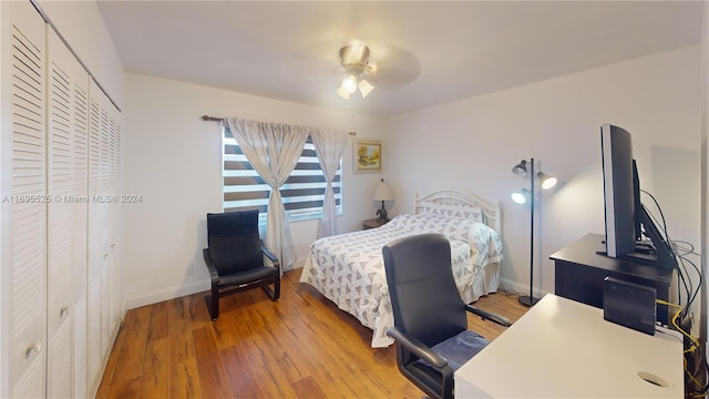 bedroom with ceiling fan and wood-type flooring