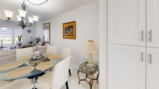 dining area with a notable chandelier