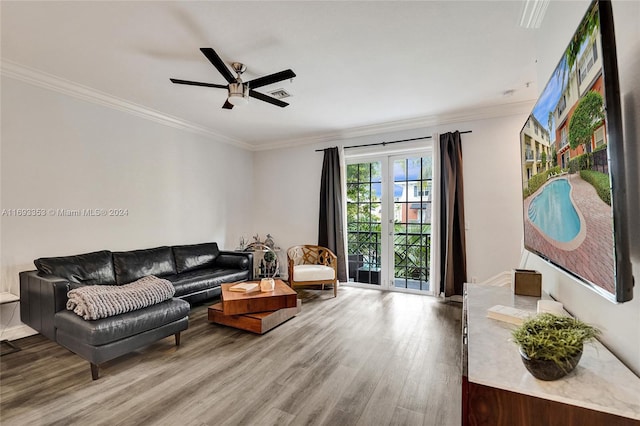 living room featuring ceiling fan, hardwood / wood-style floors, french doors, and ornamental molding