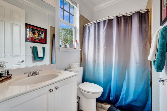 bathroom featuring hardwood / wood-style flooring, vanity, toilet, and ornamental molding