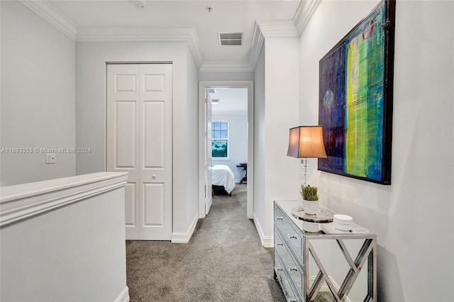 hall featuring carpet flooring and ornamental molding