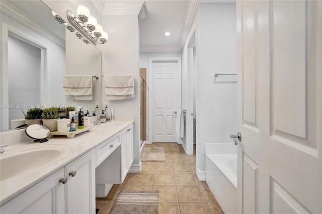 bathroom with tile patterned flooring, vanity, a bathing tub, and ornamental molding