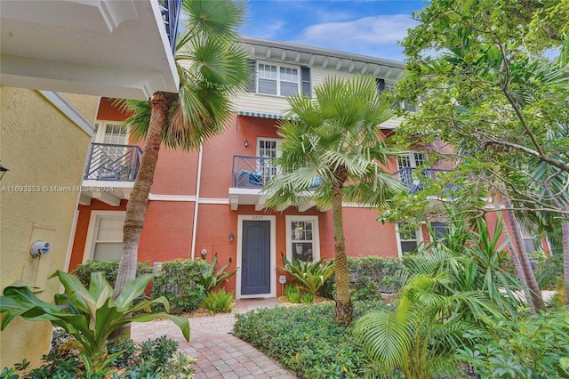 view of front of house with a balcony