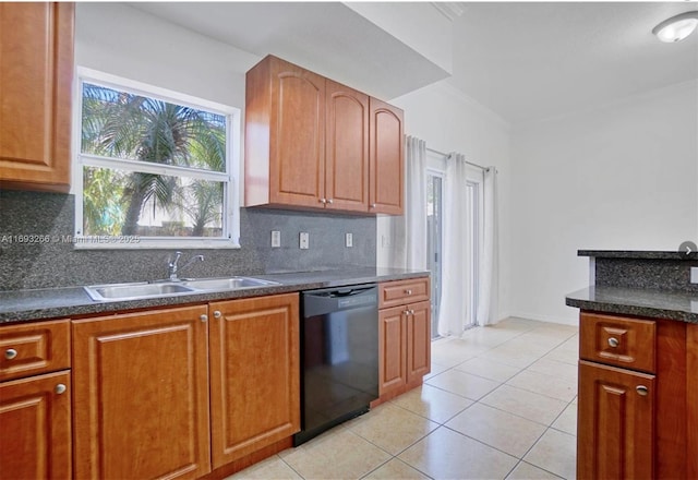 kitchen with light tile patterned floors, black dishwasher, decorative backsplash, and sink