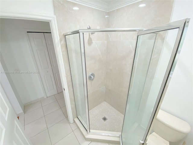 bathroom featuring toilet, tile patterned flooring, and walk in shower