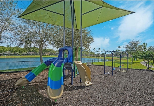 view of jungle gym with a water view