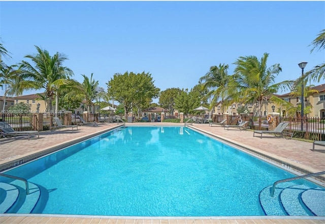 view of swimming pool featuring a patio area