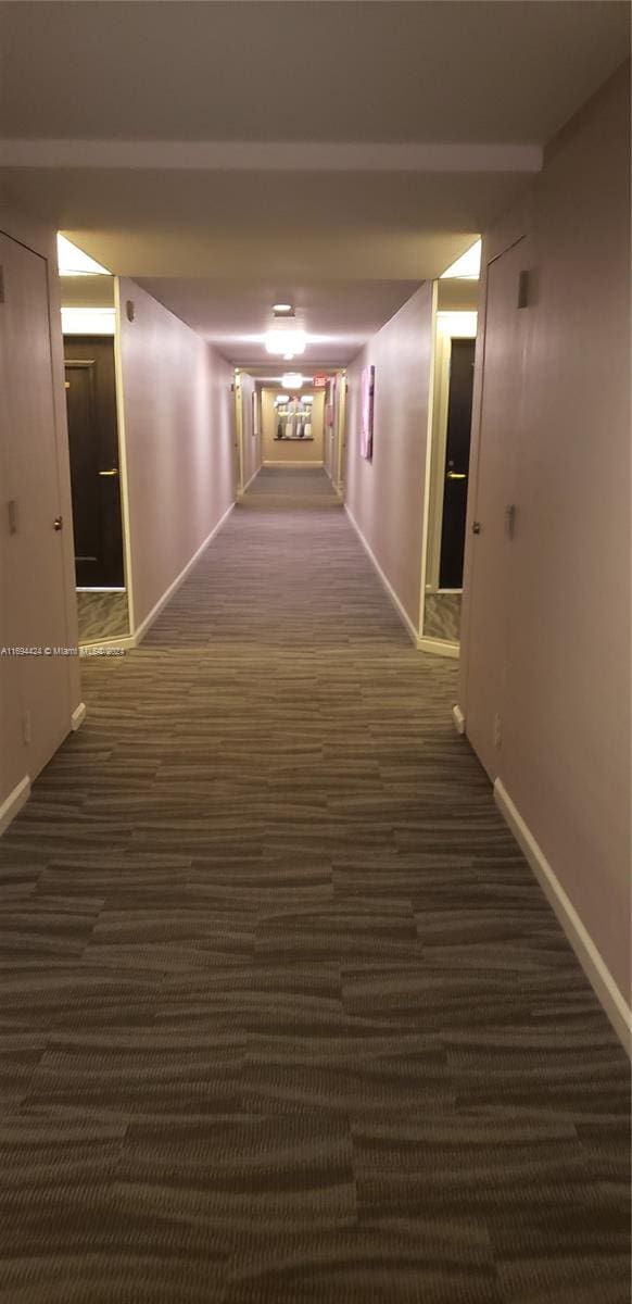 corridor with dark carpet