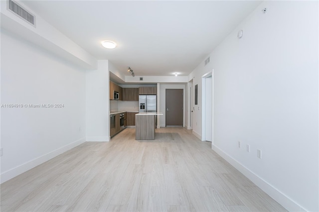 unfurnished living room featuring light hardwood / wood-style flooring