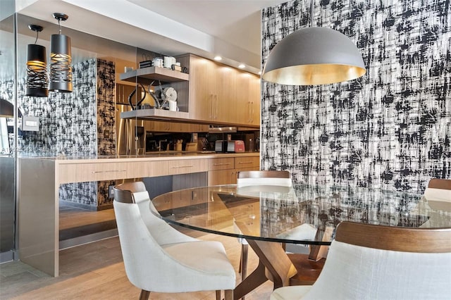 dining area with light wood-type flooring