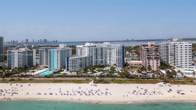 drone / aerial view featuring a view of the beach and a water view