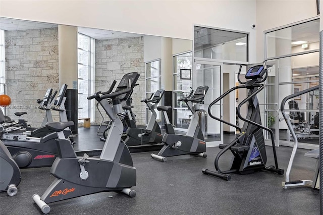 gym with a towering ceiling