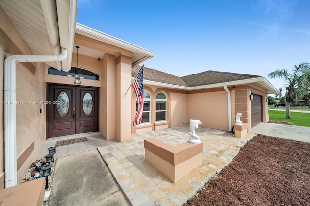 doorway to property featuring a garage