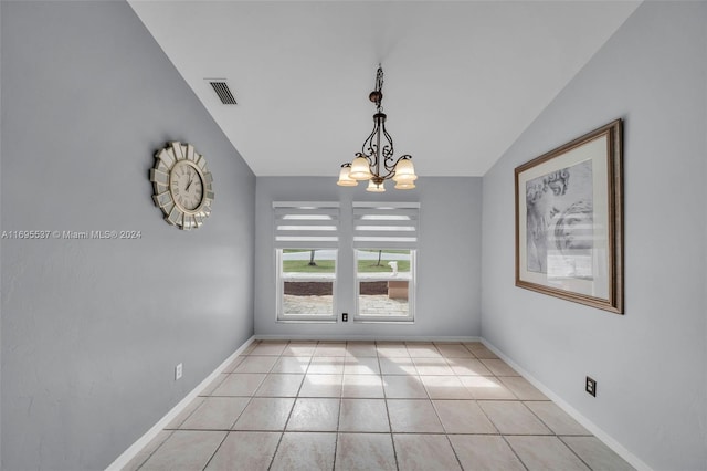 unfurnished dining area with light tile patterned flooring, lofted ceiling, and a chandelier