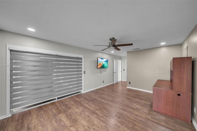 unfurnished living room with ceiling fan and hardwood / wood-style flooring