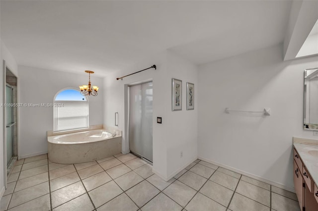 bathroom featuring plus walk in shower, tile patterned flooring, vanity, and a notable chandelier