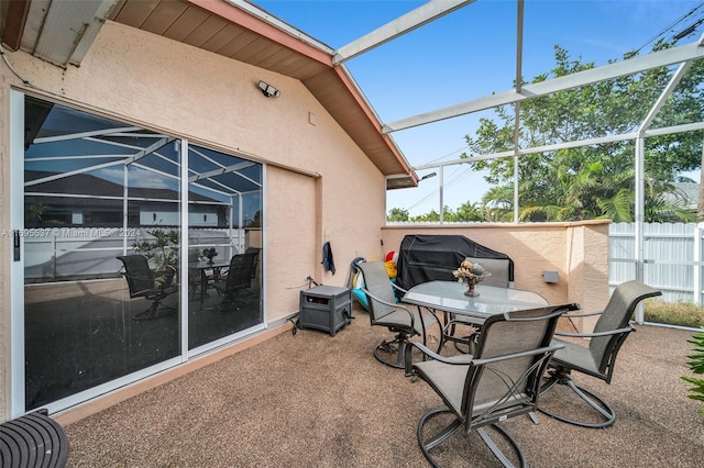 view of patio with a lanai and grilling area