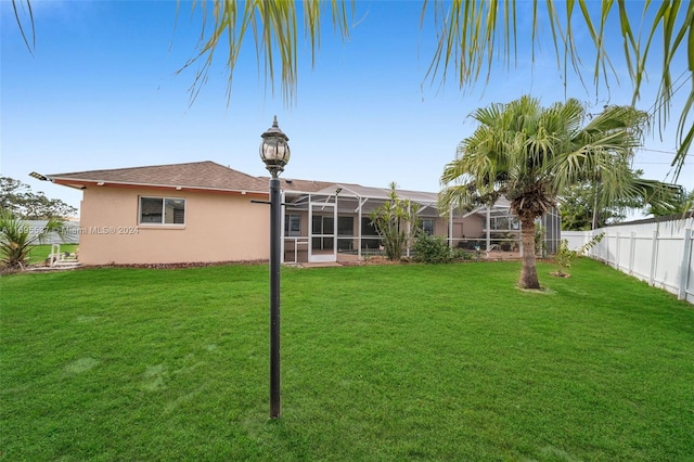 view of yard with a lanai