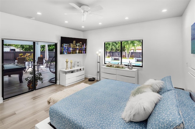 bedroom with ceiling fan, light hardwood / wood-style flooring, pool table, and multiple windows