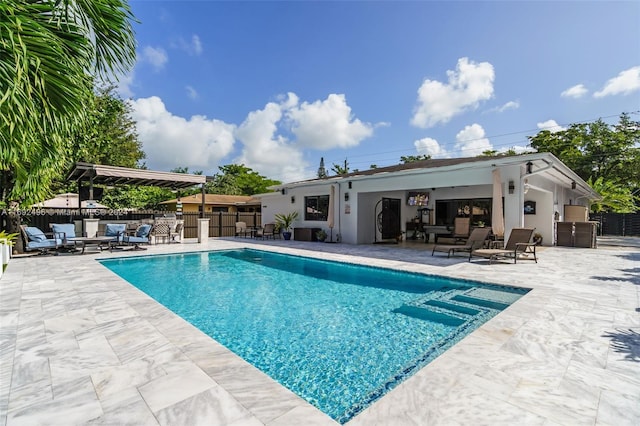 view of swimming pool featuring a patio