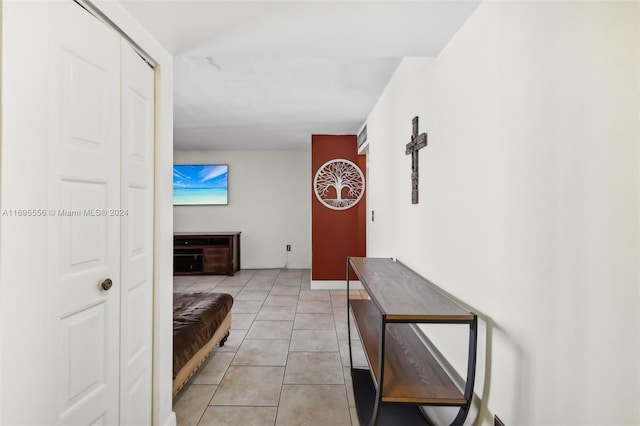 hallway featuring light tile patterned flooring