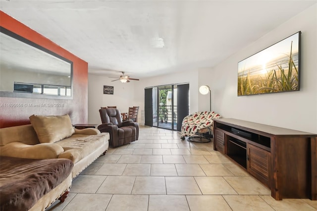 tiled living room with ceiling fan