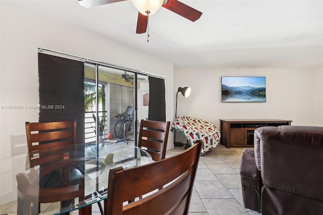 tiled dining area with ceiling fan