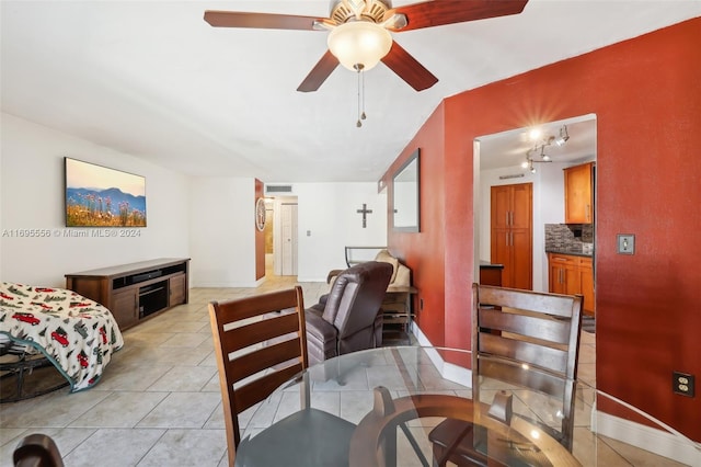 tiled living room featuring ceiling fan