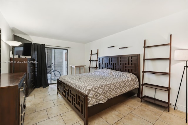 tiled bedroom with access to outside