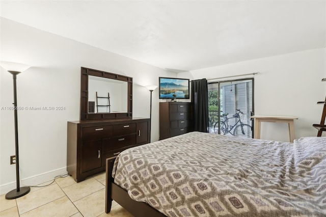 tiled bedroom featuring access to exterior