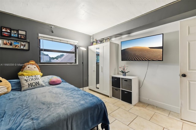 bedroom with light tile patterned flooring