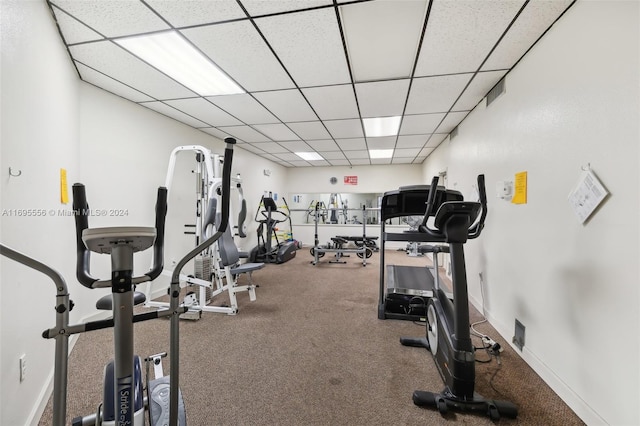 workout area featuring a paneled ceiling