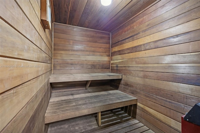 view of sauna with wood walls and wood ceiling