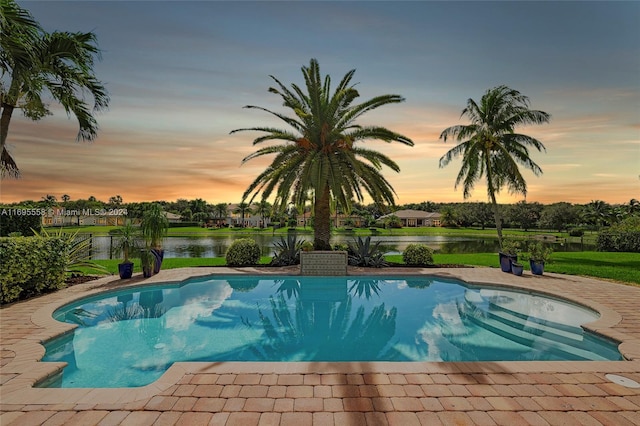 pool at dusk with a water view