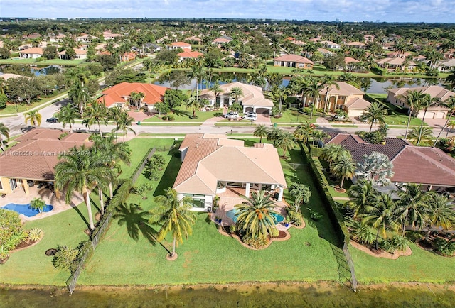 birds eye view of property with a water view