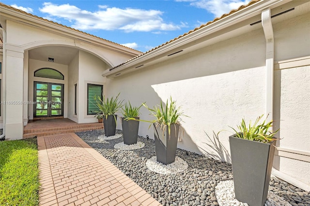 property entrance featuring french doors