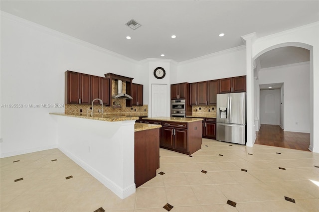 kitchen with stainless steel appliances, tasteful backsplash, kitchen peninsula, light tile patterned floors, and ornamental molding