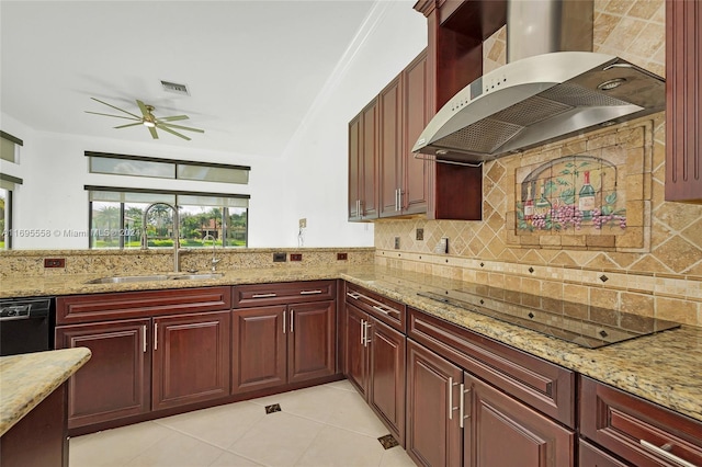 kitchen with black appliances, sink, wall chimney exhaust hood, light stone countertops, and light tile patterned floors