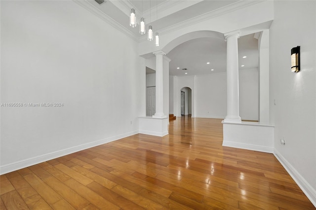 interior space with wood-type flooring and crown molding