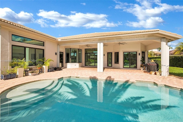 view of pool featuring a patio and ceiling fan