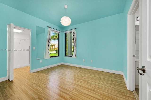 empty room with light hardwood / wood-style floors