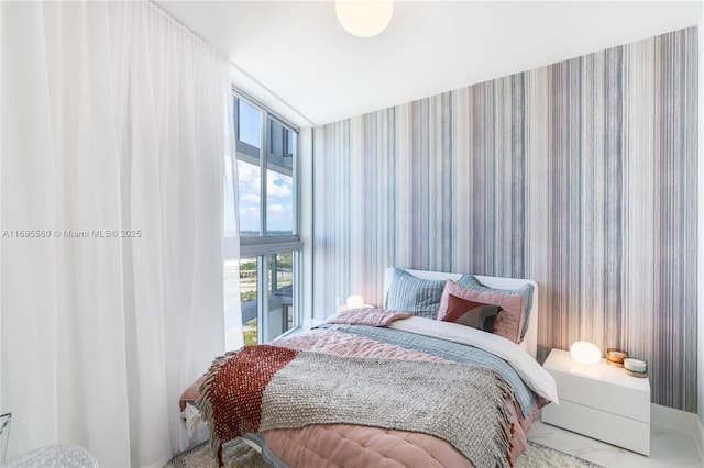 bedroom with a wall of windows