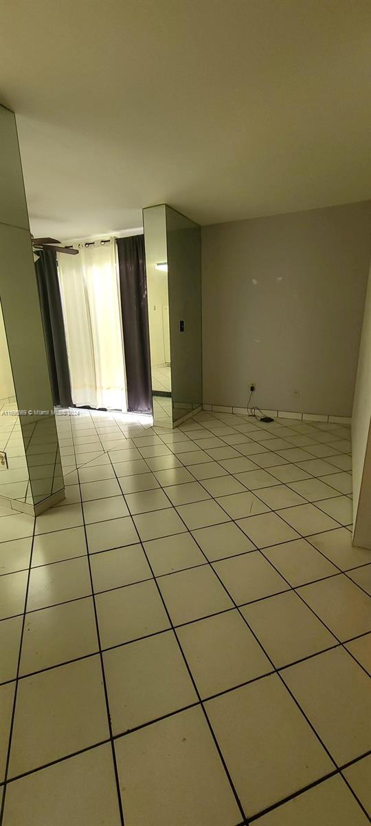 3564 Magellan Cir Unit 211-1, Aventura, FL 33180 - spare room featuring light tile patterned floors