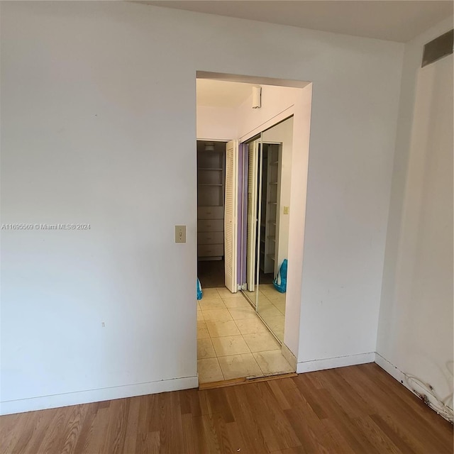 unfurnished room featuring light hardwood / wood-style floors